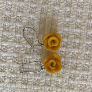 Mustard yellow handmade clay earrings.